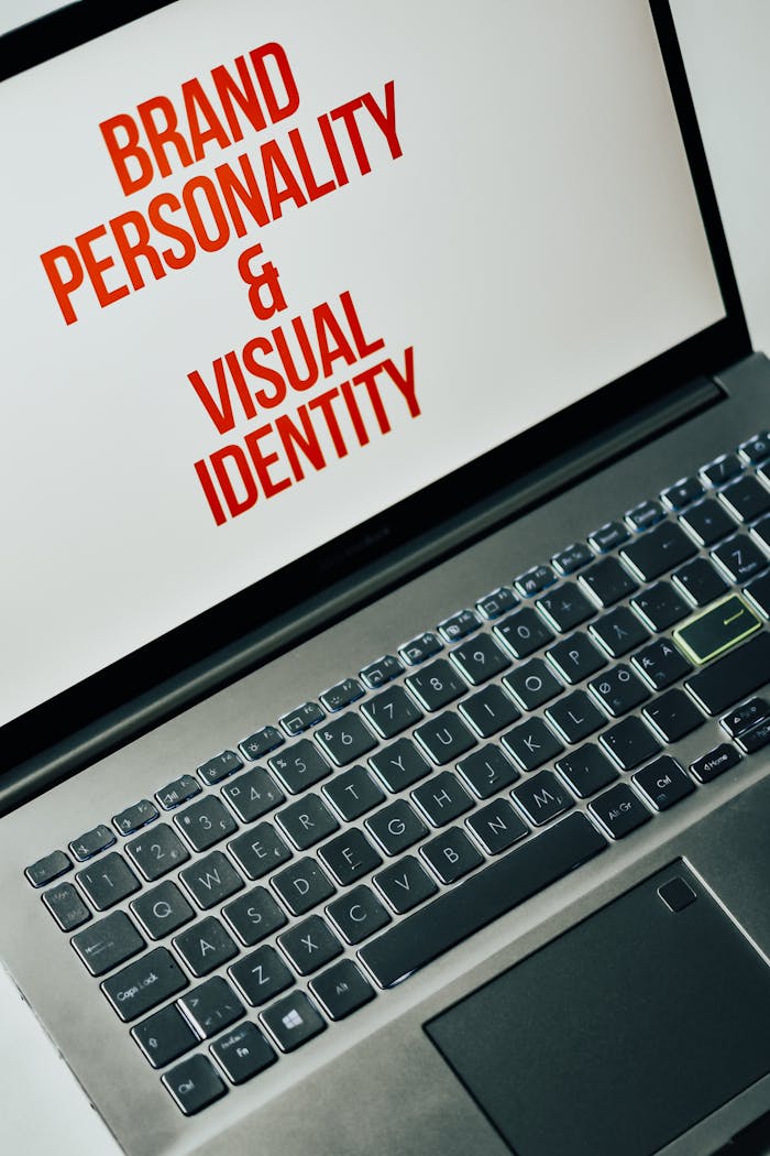 our-journey-02 Laptop screen showing text on brand personality and visual identity for marketing strategy.